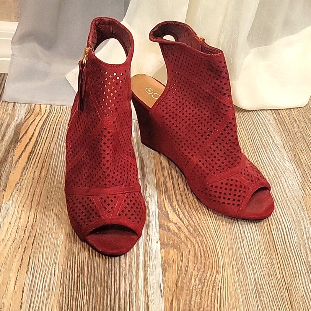 Gently worn red leather heels zio up, with cut outs